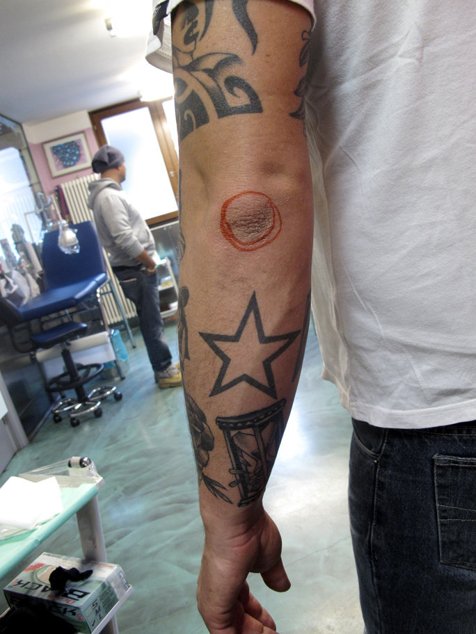 Star Tattoo Around Elbow. pre-existing star tatto…